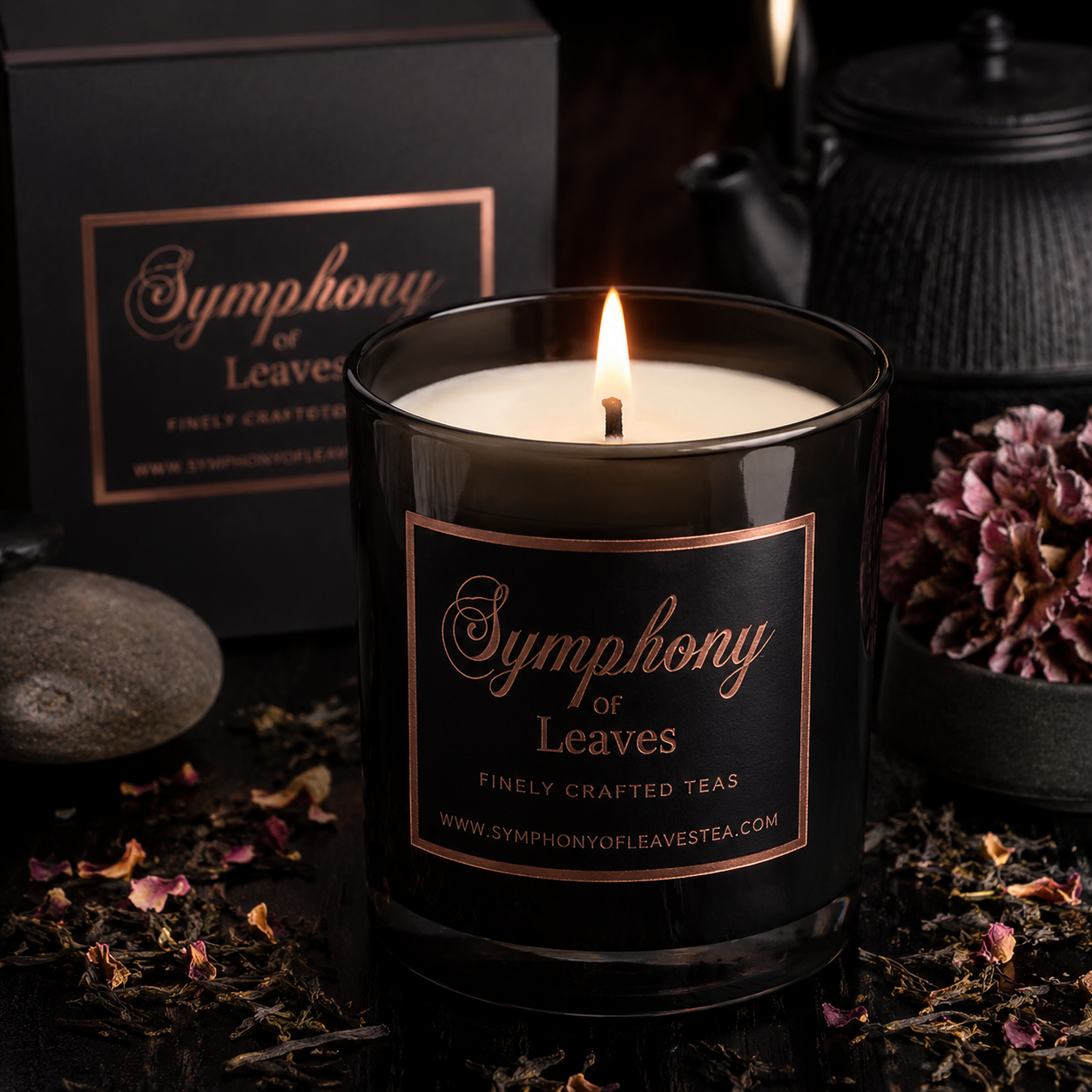 Symphony of Leaves Signature Candle with gift box, styled with dried rose petals and loose leaf tea