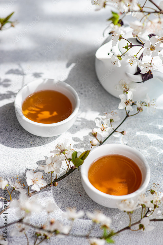 White tea in a white cups on white background