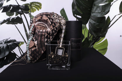 Cocoa Day Blend on a Black table with an African Mask and an antique spoon in the blend