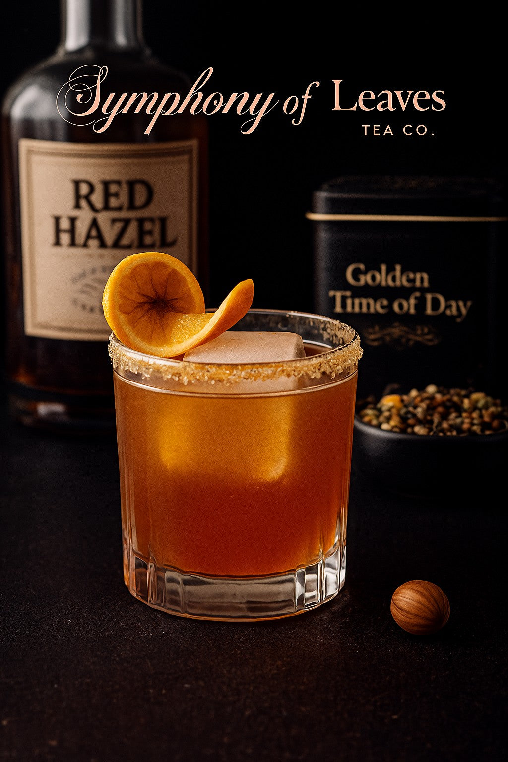 Golden Time of Day tea–infused Red Hazel whiskey cocktail with dried orange garnish, photographed against a black background with the Symphony of Leaves Tea Co. logo and loose-leaf tea