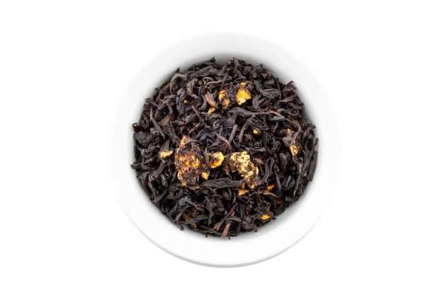 Nepal oolong tea leaves with dehydrated bananas in a white bowl on a white background