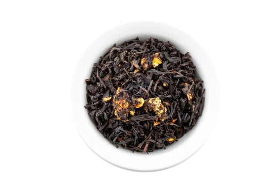 Nepal oolong tea leaves with dehydrated bananas in a white bowl on a white background