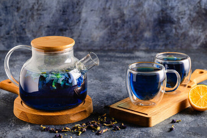 Brewed Imagination Tea-Blue-on wood boards, orange in the background