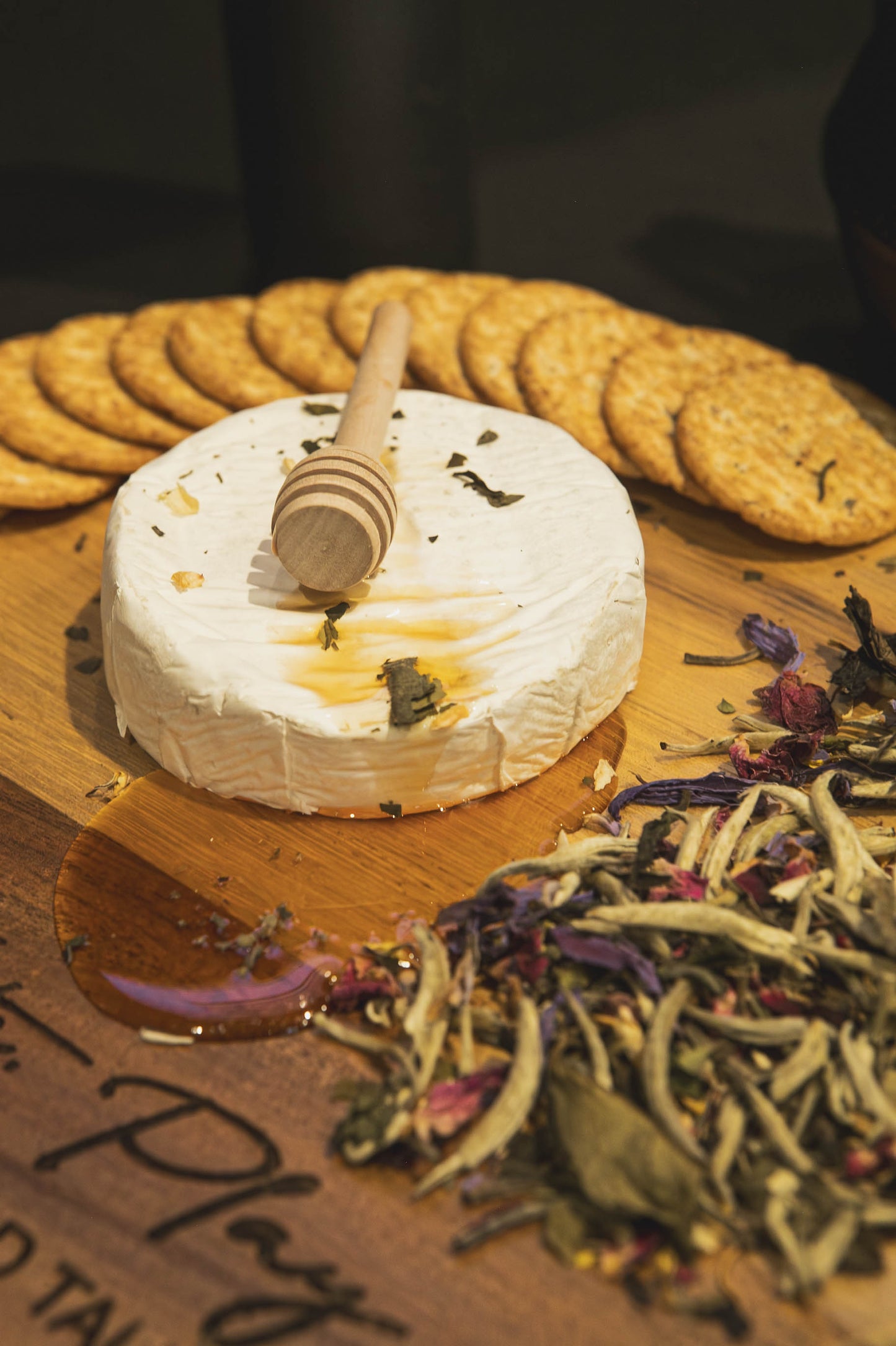 Simply Gorgeous White Tea Blend on a board with Brie cheese, honey and crackers from www.iftheseboardscouldtalk.com