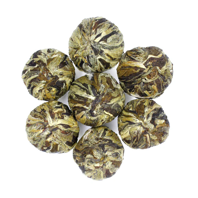 Hand tied green tea balls infused with jasmine.