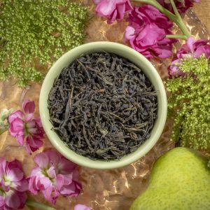 Green tea leaves with pink flowers and pear