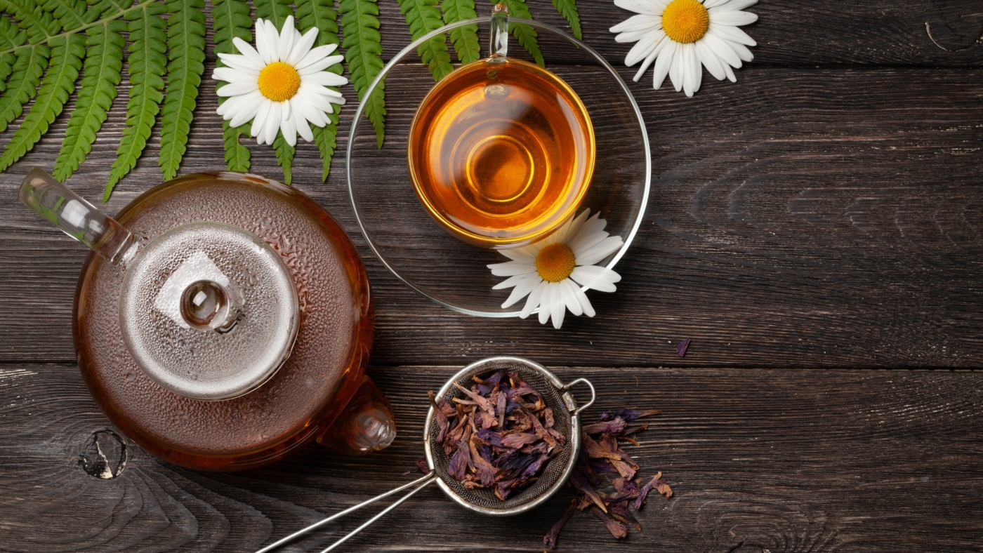 Tea with dried herbs and chamomile flowers