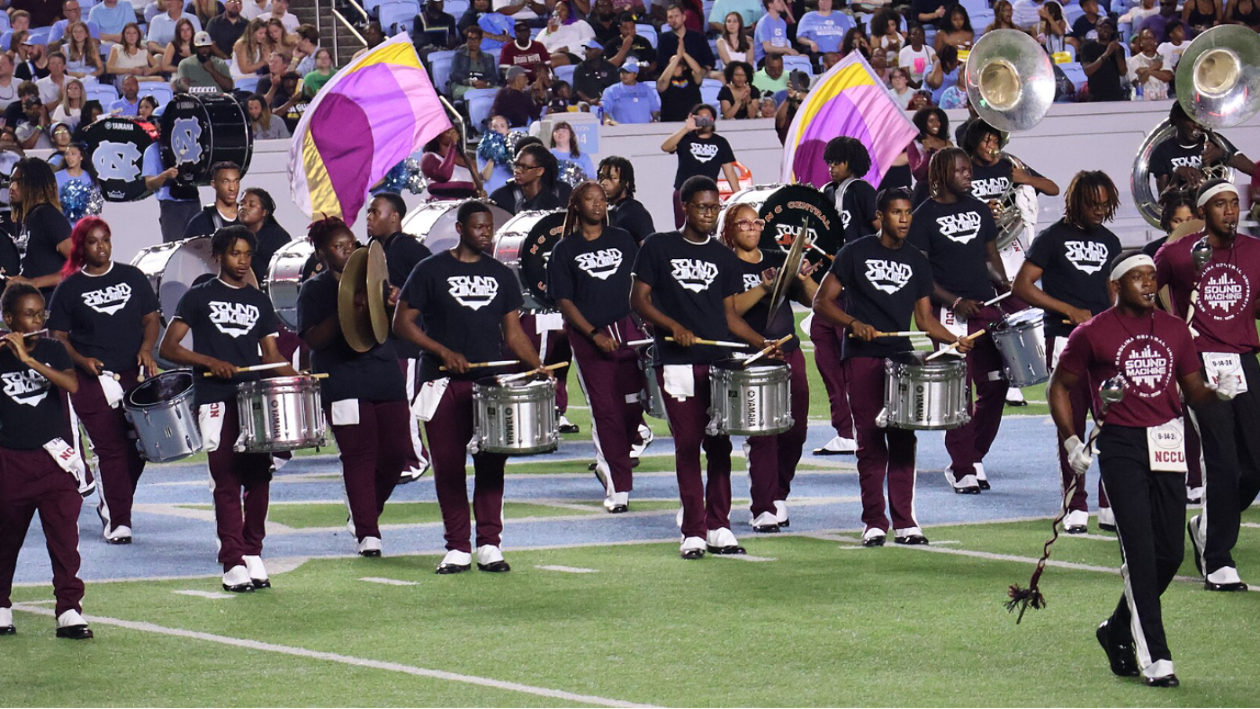 Marching band performing at a sports event.