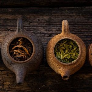 Two rustic teapots with loose leaf tea