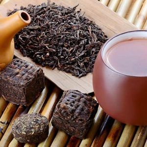 Pu-erh tea with teapot and tea leaves