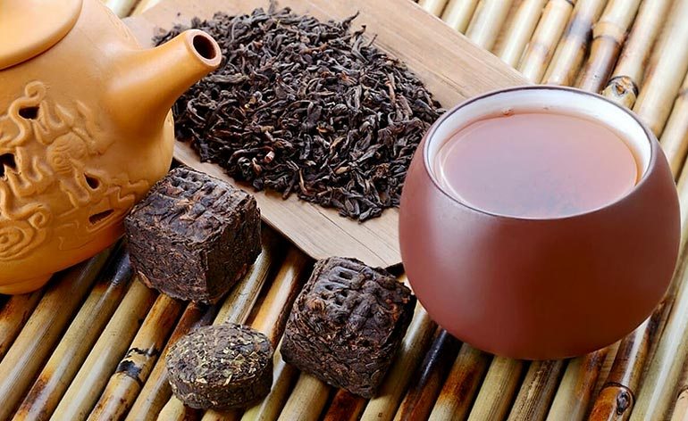 Pu-erh tea with teapot and tea leaves