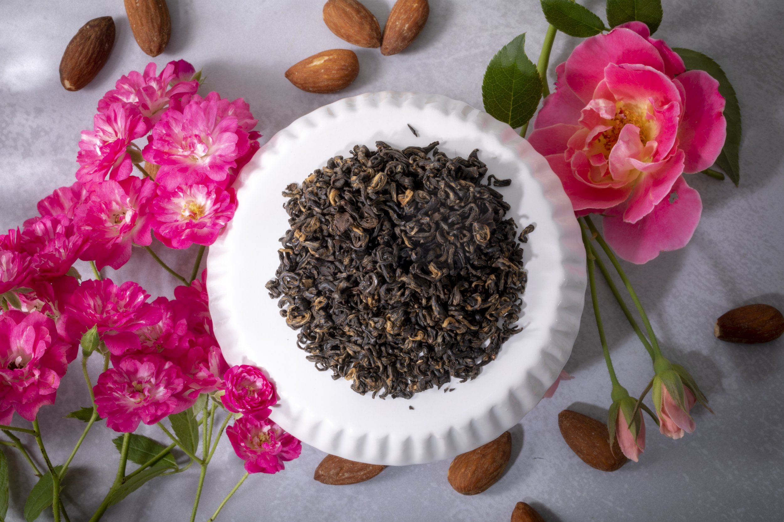 Loose tea leaves with flowers and almonds