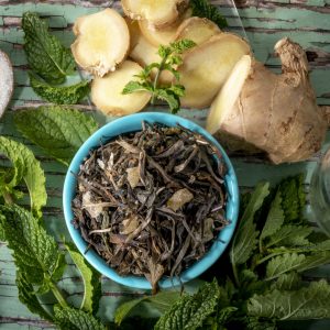 Herbal tea ingredients with ginger and mint.