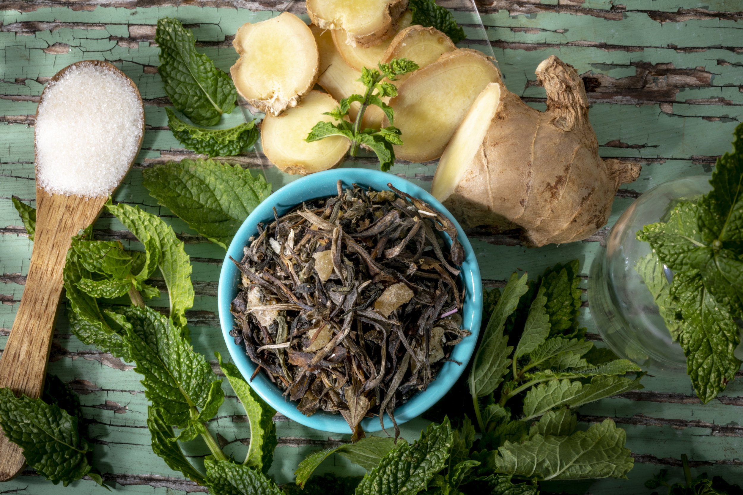 Herbal tea ingredients with ginger and mint.