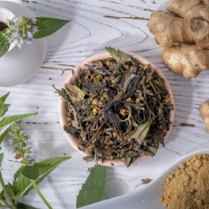 Herbal tea ingredients with fresh ginger and leaves