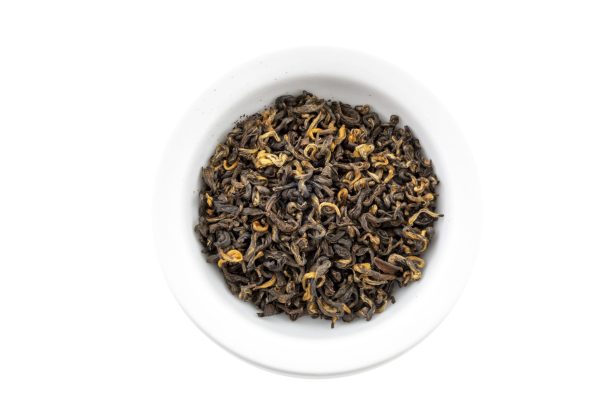 Bowl of loose leaf black tea leaves