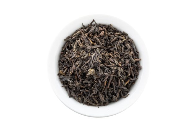 Loose leaf black tea in white bowl