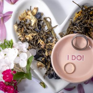 Heart-shaped dish with flowers and rings