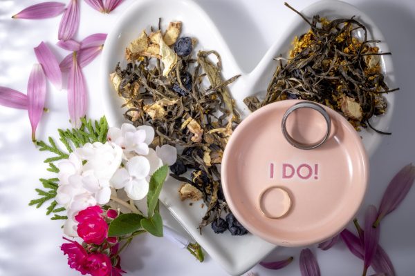 Heart-shaped dish with flowers and rings